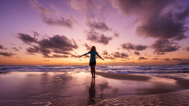 woman reflecting in nature during a moment of reconnecting with purpose