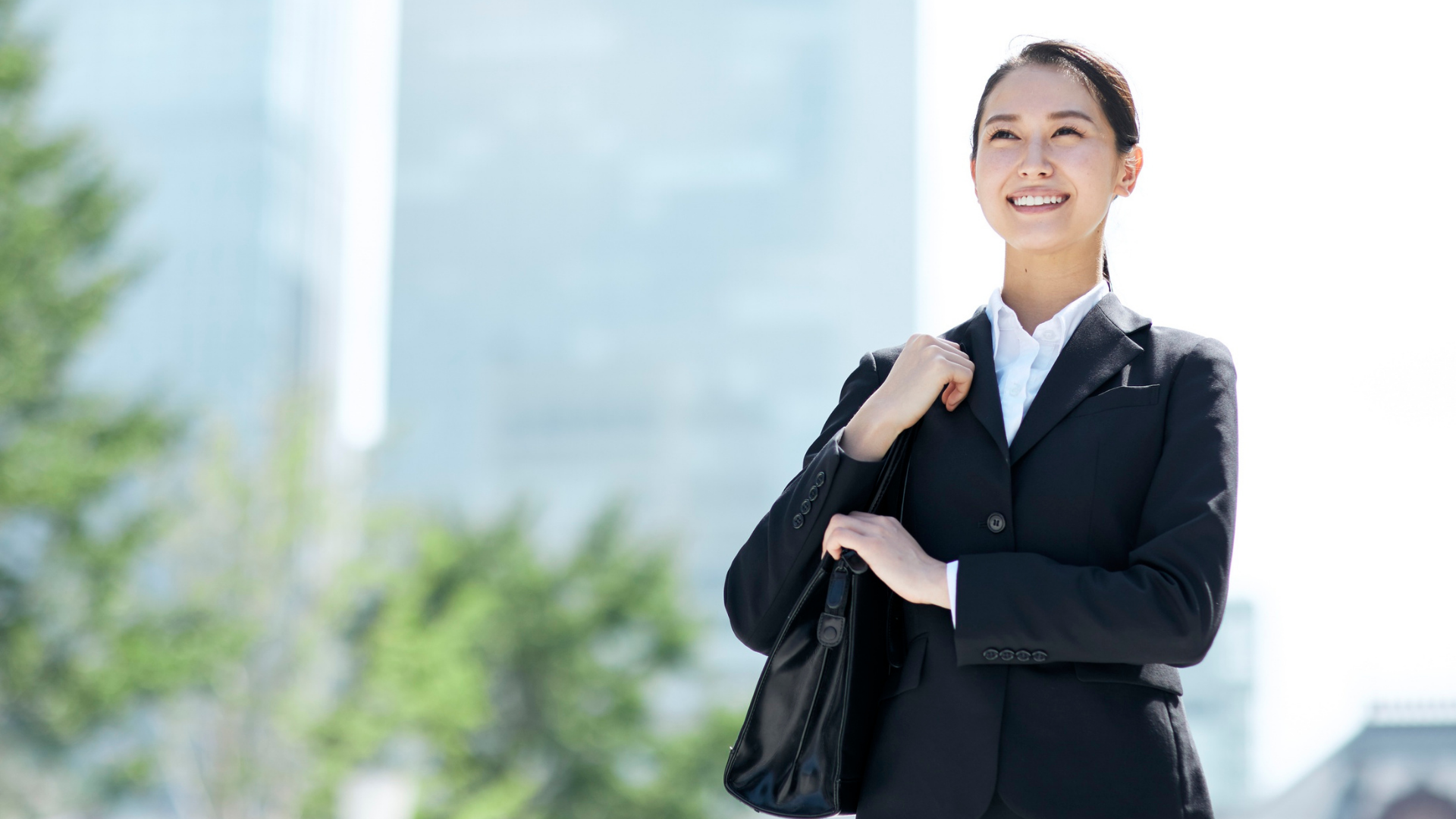 Professional woman looking ahead as she transitions into a coaching career.